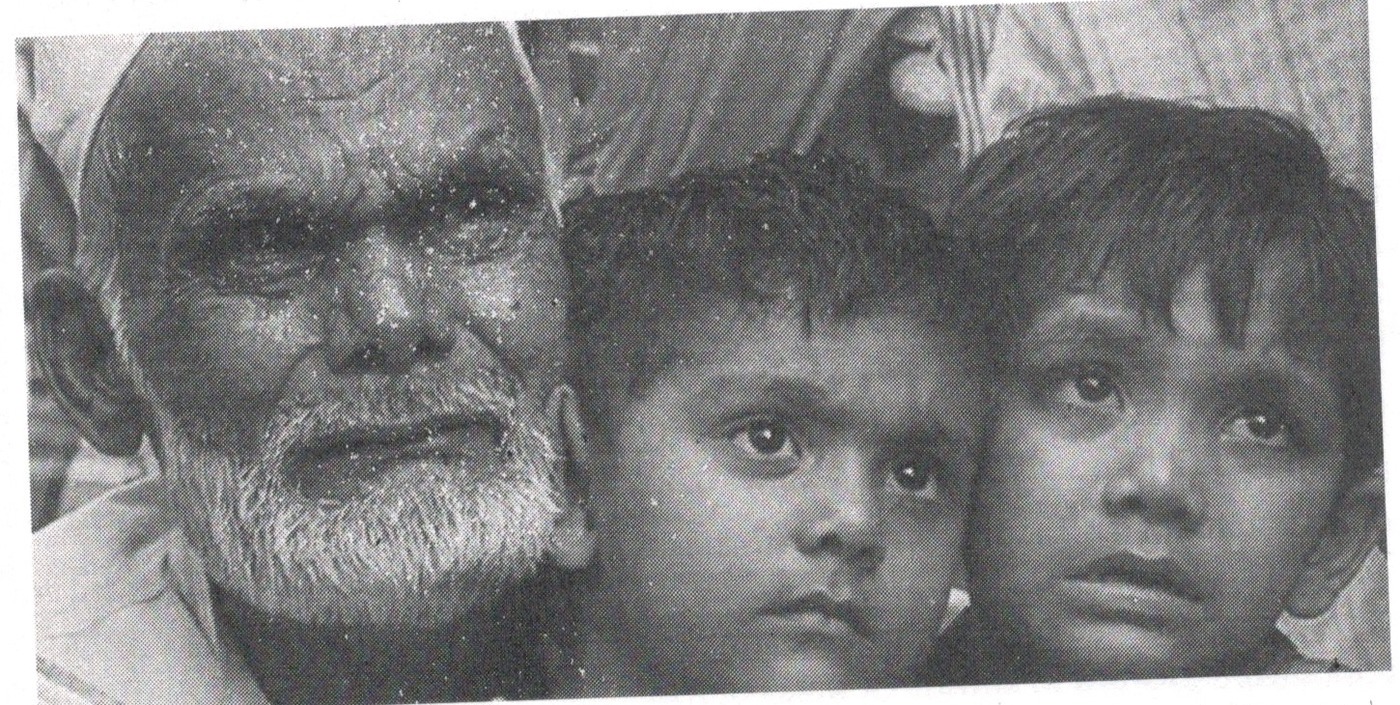Older man pictured with two children