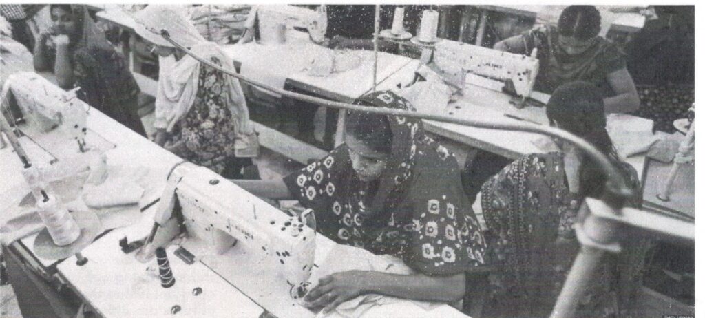 Women working at sewing machines in a garment factory