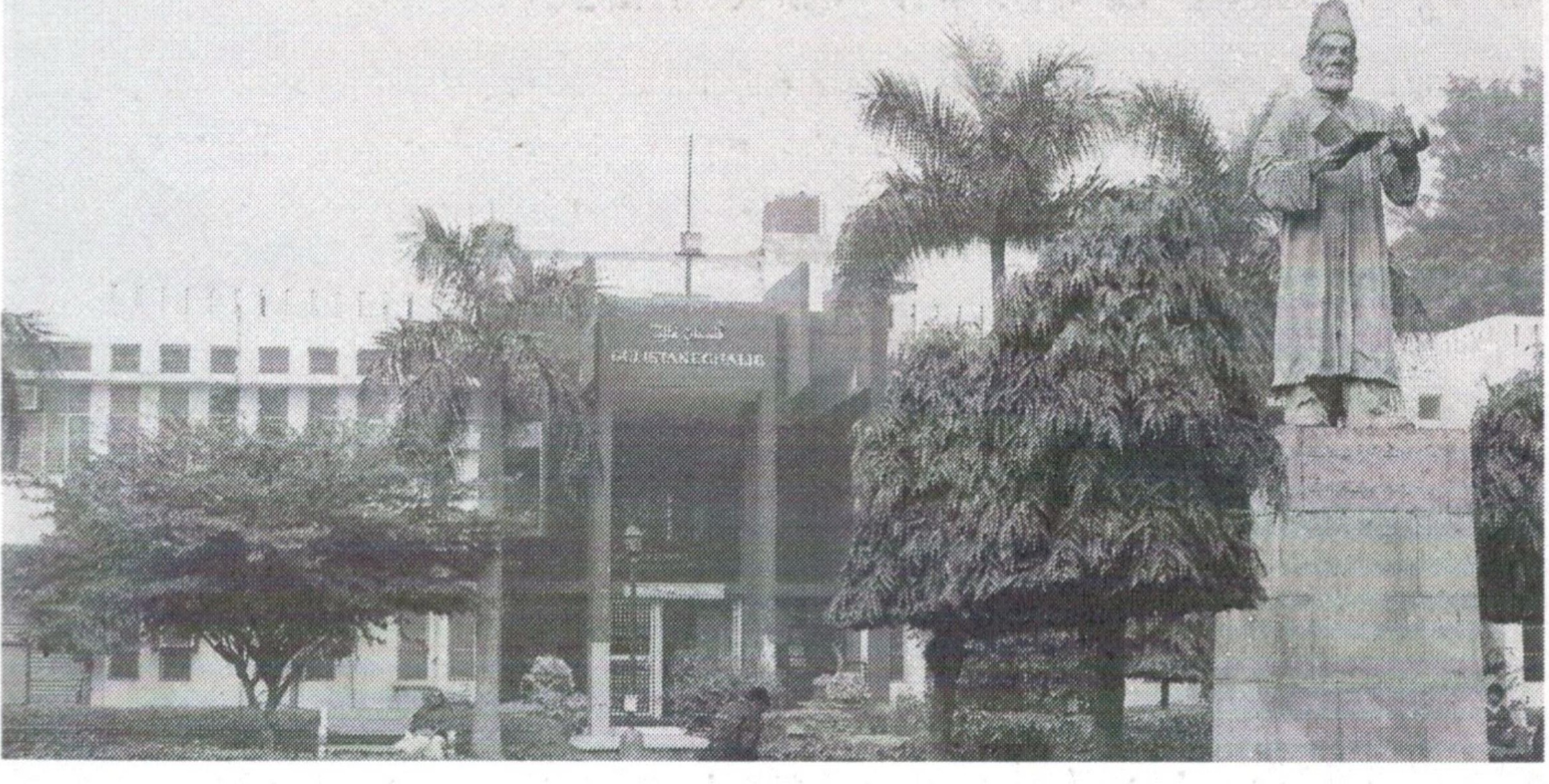 Aligarh Muslim University campus with a statue in the foreground