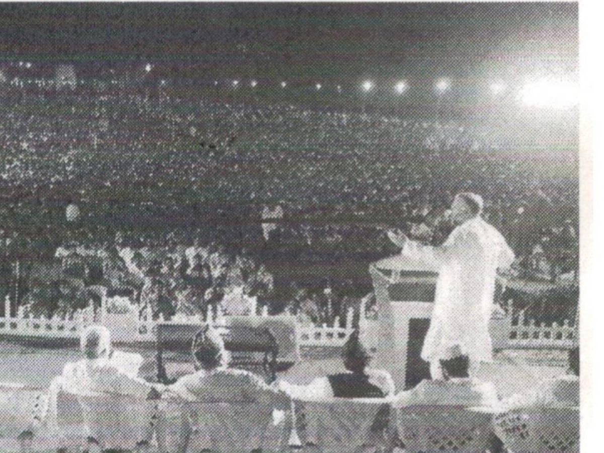 Speaker addressing a large public gathering