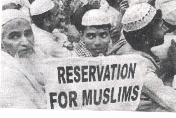 Muslim demonstrators gathered around a placard reading Reservation for Muslims